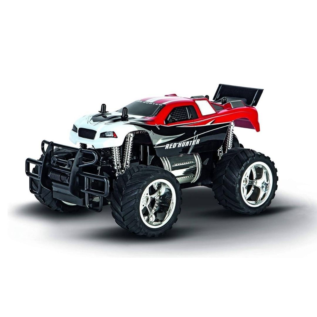 Carrera RC Red Hunter X 1:18 scale monster truck in red and white with extra-large pneumatic tires and full-spring suspension for off-road racing.