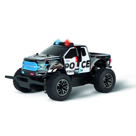 Official Ford licensed F-150 Raptor Police RC truck by Carrera, featuring black and white police livery, oversized off-road tires, and rugged suspension.