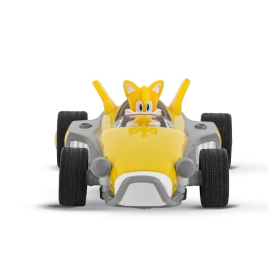 Carrera Sonic Racing Crossworlds slot car set featuring Miles "Tails" Prower in his signature yellow racing vehicle with ergonomic speed controllers and dynamic curve track layout.