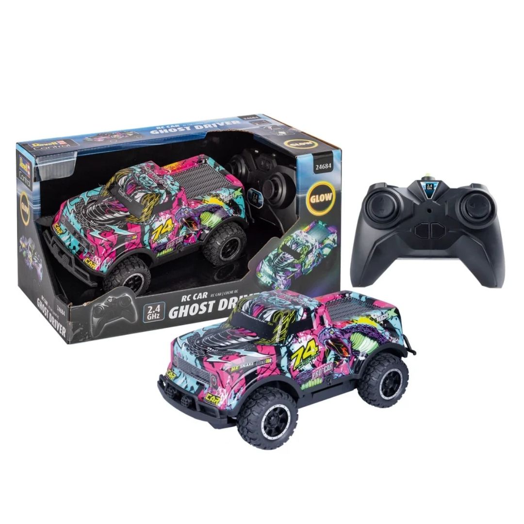 High-performance Revell Ghost Driver RC stunt car in a vibrant pink and multicolor finish, featuring oversized high-grip tires and a 2.4 GHz pistol-grip remote control.