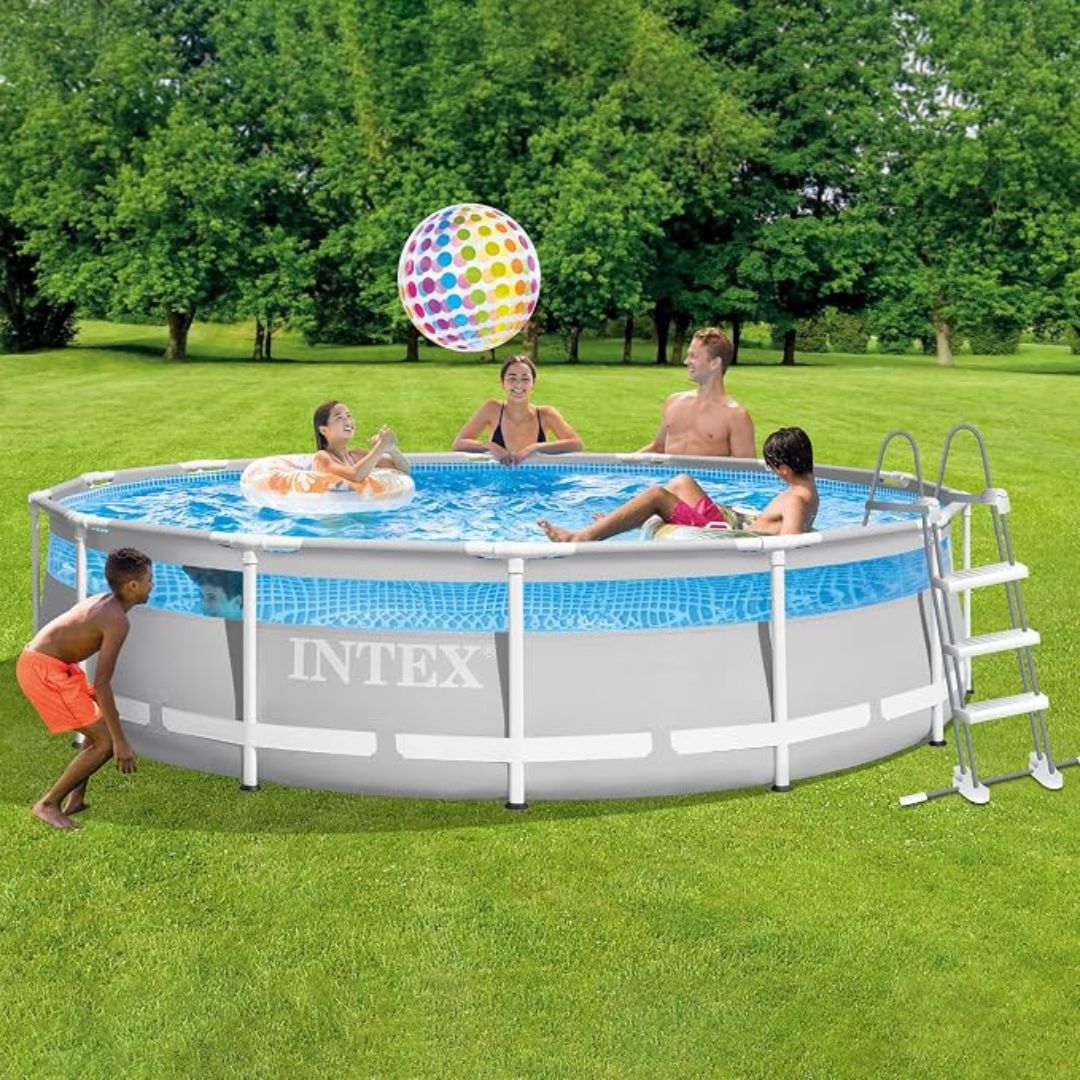 Intex Prism Frame Clearview round pool set set up in a backyard lawn featuring a panoramic clear window stripe around the liner, sturdy powder-coated steel frame, and safety ladder.