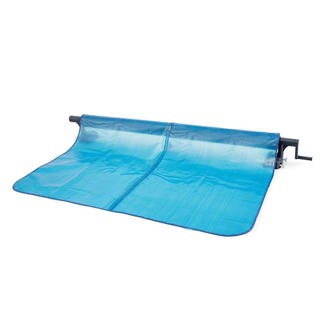Intex solar pool cover attached to a heavy-duty "manual" aluminum reel system with a hand crank, partially rolled out over water.