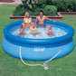 A family enjoying an Intex 10ft Easy Set inflatable pool in a backyard setting, featuring a blue circular design with a top inflatable ring and an attached filter pump.