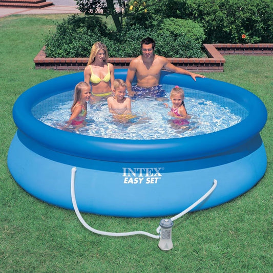A family enjoying an Intex 10ft Easy Set inflatable pool in a backyard setting, featuring a blue circular design with a top inflatable ring and an attached filter pump.