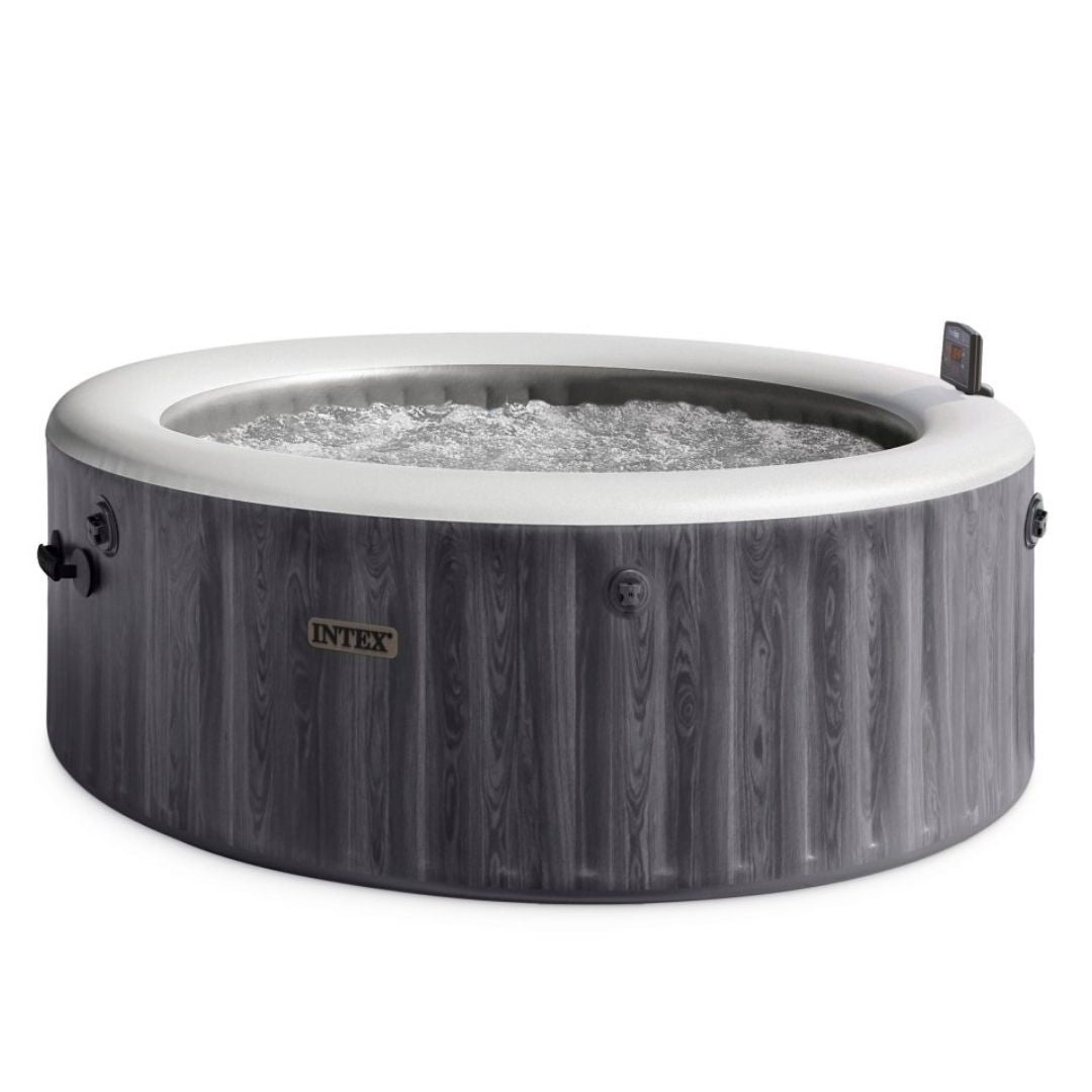Intex PureSpa Greywood Deluxe hot tub with a realistic gray woodgrain pattern finish and an integrated digital control panel.