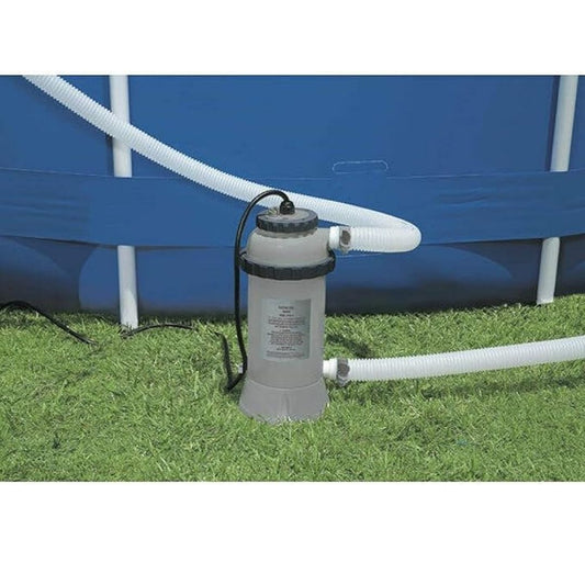Compact gray Intex electric pool heater unit connected to a blue above ground pool with durable white hoses on a green lawn.