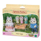 Vibrant multicolor Sylvanian Families Husky Family set featuring two adult husky figures in detailed fabric clothing and three triplets sitting in a small yellow push-along sled.