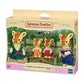 Vibrant multicolor Sylvanian Families Highbranch Giraffe Family set featuring four soft-flocked giraffe figures with detailed orange spots, including parents and two infants with a camera and binoculars.