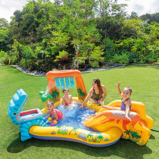 Intex Dinosaur Play Center inflatable water park featuring a built-in slide, a palm tree water sprayer, and colorful dinosaur figures with game balls.