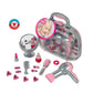Theo Klein Braun Beauty Case play set featuring a portable carrying case filled with a battery-operated toy hair dryer, hairbrush, comb, play lipstick, perfume bottle, and styling accessories.
