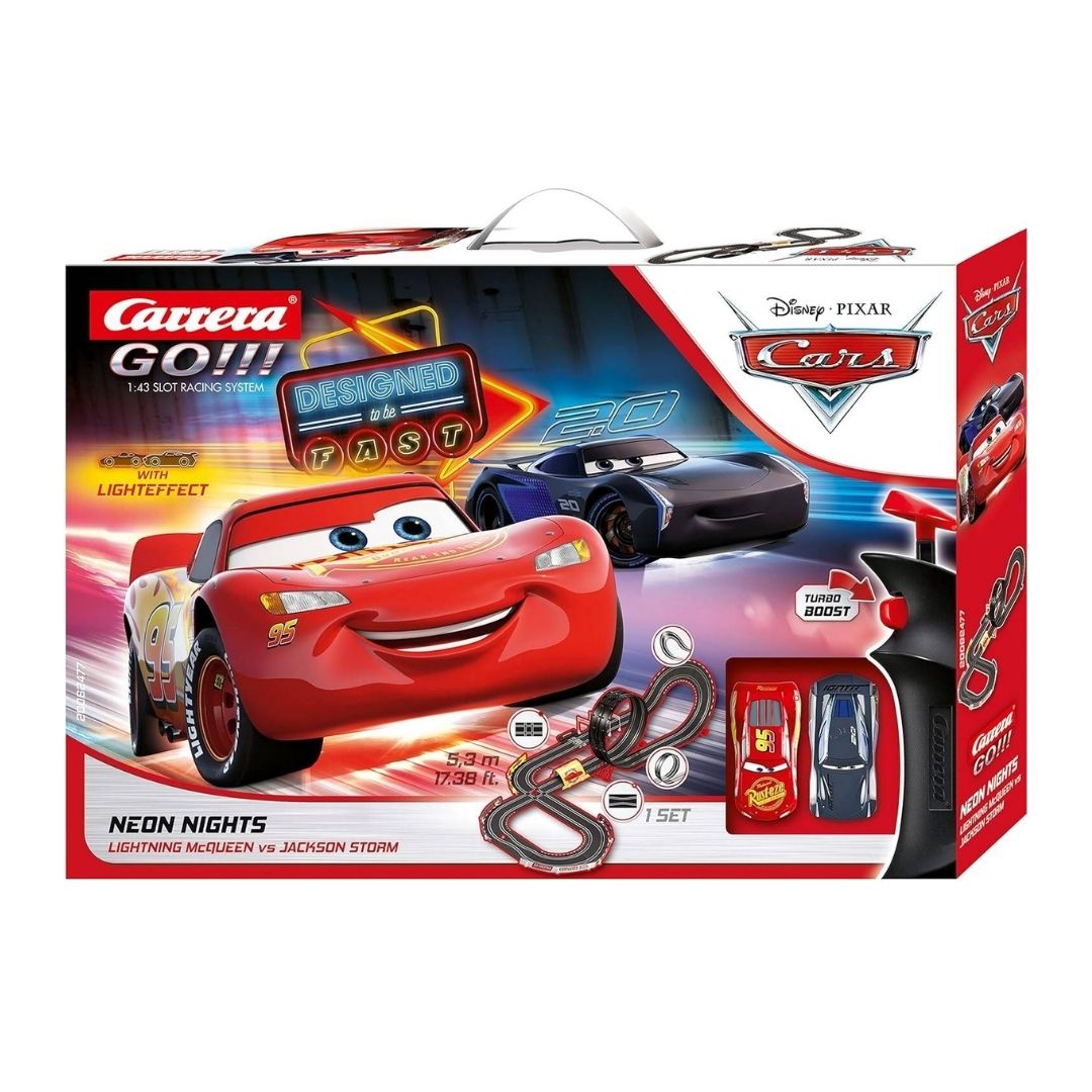 Carrera GO!!! Neon Nights slot car racing set featuring Lightning McQueen and Jackson Storm on a 5.3-meter track with a loop-the-loop and neon-glow light effects.