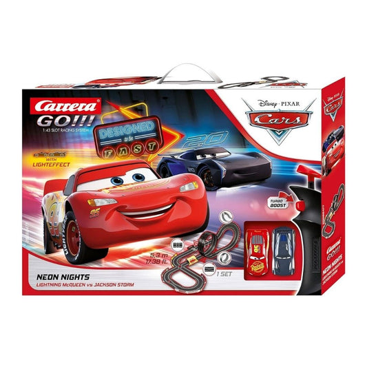 Carrera GO!!! Neon Nights slot car racing set featuring Lightning McQueen and Jackson Storm on a 5.3-meter track with a loop-the-loop and neon-glow light effects.