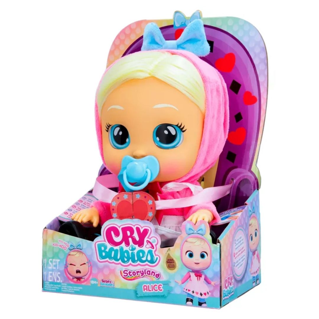 Cry Babies Storyland Alice doll featuring a blue and white storybook-inspired outfit, blonde hair, and large expressive eyes, holding a matching pacifier in a multicolor display box.