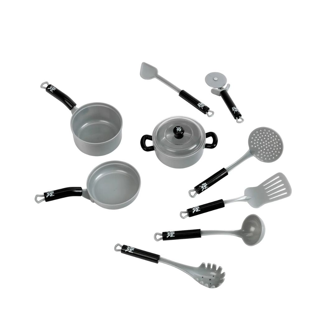Theo Klein WMF play kitchen equipment set featuring toy pots with lids, frying pan, saucepan, turned spatulas, ladle, and cooking utensils.