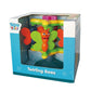 Tanny Toys Twirling Bees activity toy featuring four colorful bee characters that rotate on a central axis with a heavy-duty suction cup base for tabletop play.