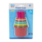Ocean Cups sand toy set by Tanny Toys, featuring stackable multicolor cups with ocean patterns for beach and water play.